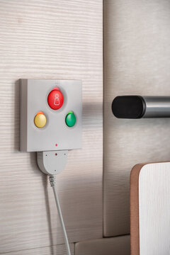 Close up of nurse call system with emergency buttons installed near bed in medical room in hospital