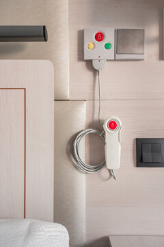 Nurse call system with emergency buttons installed near bed in medical room in hospital