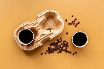 Paper coffee cups with coffee beans. Top view