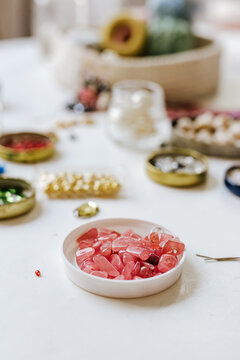 High angle of decorative stones with beads and sequins for creating decorative accessories