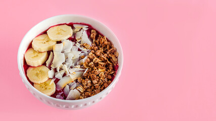 Smoothie bowl with acai, banana, blueberries, kiwi fruit and black currants. Healthy super food with fresh fruit. Vegetarian and organic nutritional food