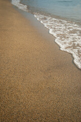 Soft wave of the sea on the sandy beach
