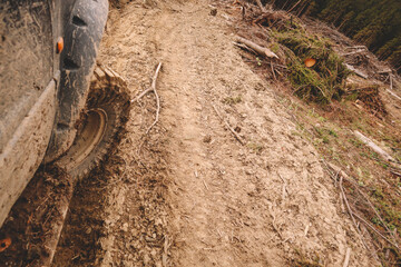 Dirty cars and wheels in the mountains. Swamp on the tires. Trips offroad across Ukraine. View of the Carpathian Mountains.