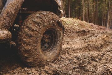 Dirty cars and wheels in the mountains. Swamp on the tires. Trips offroad across Ukraine. View of the Carpathian Mountains.