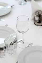Wedding. Banquet. Table for guests, are served with cutlery and crockery and covered with a tablecloth.