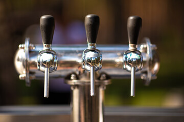 Silver Cranes for bottling beer or wine on open air. The concept of outdoor recreation, picnic, corporate.