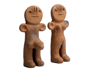 Ancient clay male and female figurines from Canary Islands isolated on white background