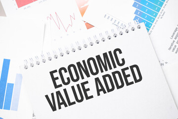 economic value added text on paper on the chart background with pen