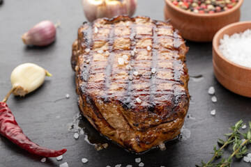 Fresh delicious juicy steak with vegetables and spices