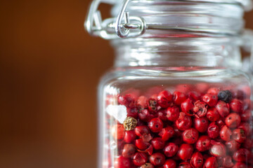 Red peppercorn in spice jar 