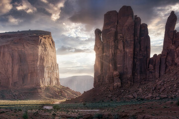 Spectacular scenery of tall rocky formations located in Monument Valley in America under colorful sky at sunset