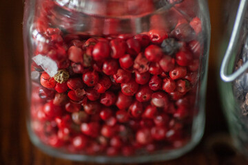 Red peppercorn in spice jar 