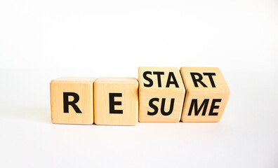 Restart and resume symbol. Turned cubes and changed the word 'restart' to 'resume'. Beautiful white background. Business and restart - resume concept. Copy space.