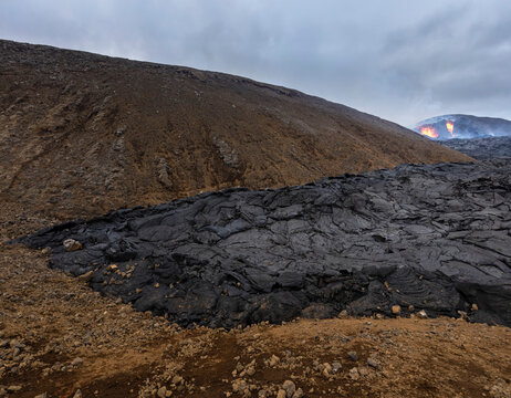 Close-up solidified magma rivers of the volcano Fagradalsfjall in Iceland on a cloudy day