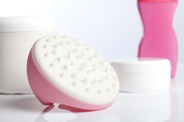 Pink massaging tool, which eliminate cellulite.