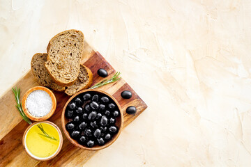 Sliced bread ciabatta with olives and oil. Greek or Italian meal