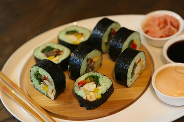 hot roll set sashimi japanese food on wooden background