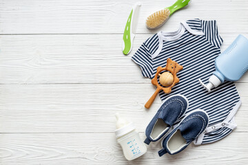 Set of baby boy accessories with milk bottle