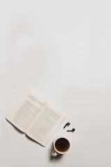 flat lay coffee, books and earphones