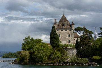 the castle of Yvoire is built on a point overlooking Lake Geneva, France