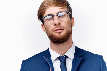 portrait of sexy man wearing glasses business finance and blue jacket tie model