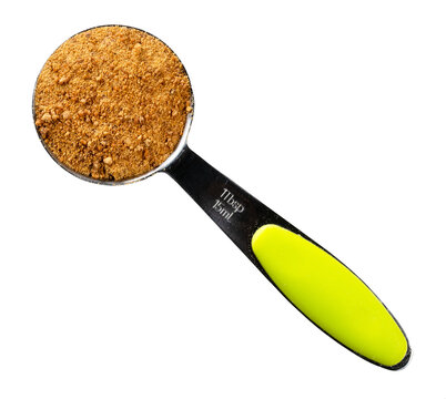 coconut blossom sugar in measuring spoon cutout
