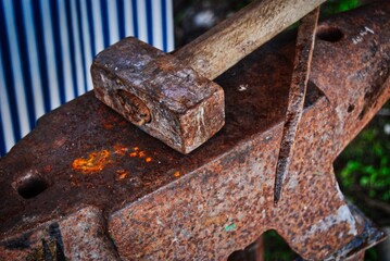 Hammer and anvil in a blacksmith's workshop