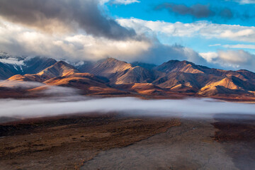 dramatic landscape of  mountain peaks and mountain ranges inside Denali National Park  during autumn season.