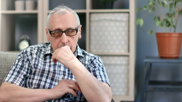 Tired elderly man 80s sleeping sitting couch feeling loneliness hopeless depression worried problem