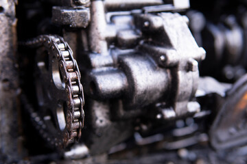 4 cylinder one motor head with disassembled exhaust manifold of old industrial heavy truck V 8 diesel engine with separate covers closeup, vehicle utilization.