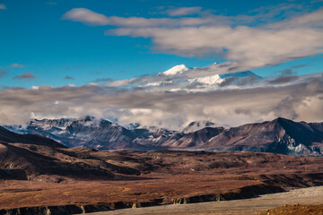 dramatic landscape of  mountain peaks and mountain ranges inside Denali National Park  during autumn season.