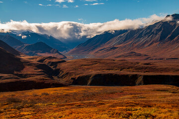 dramatic landscape of  mountain peaks and mountain ranges inside Denali National Park  during autumn season.