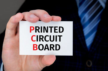 Businessman holding business card with PCB Printed Circuit Board text.