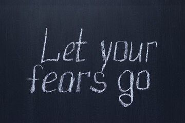 
Chalkboard writing Let your fears go. Motivational and encouraging lettering
