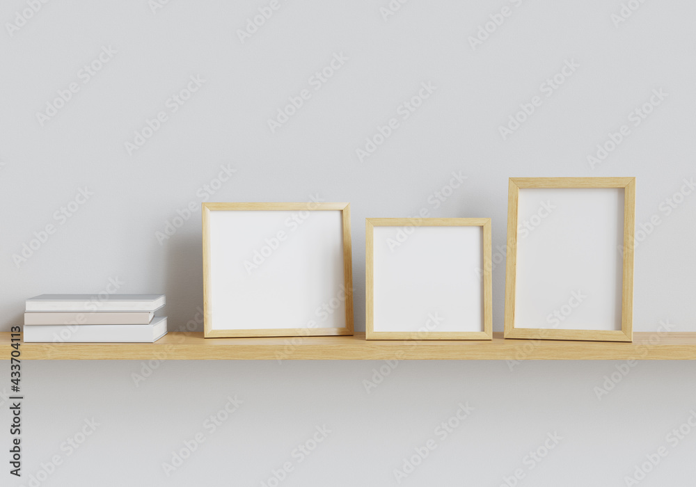 Poster Three photo mockup frames and books on the shelf. Clipping path included. 3D render. 3D illustration.