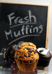 Variety of fresh muffins with a sign blackboard