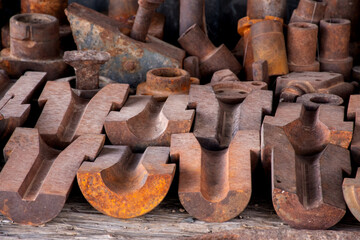 These dies were used to hold drill steels for sharpening or molds for making drills.  They were...
