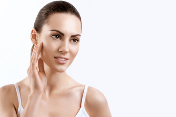 Woman Face Skin Care.  Woman Face Skin Care. Portrait Of Attractive Young Female Applying Cream....