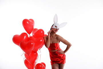 girl with red heart. Sexy mask woman. Love girl. Happy day. Love photo. Red balloons.