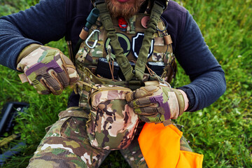 Close-up shot of an airsoft player zipping up his bag