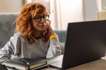 Woman using a laptop while working from home