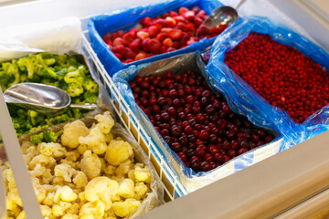 Berries on the counter. Berries in boxes.