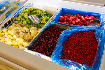 Berries on the counter. Berries in boxes.