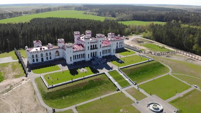 View on the old castle-palace Puslovsky, national landmark. Kossovo, Belarus. Aerial video 4K