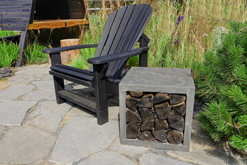 Patio with Adirondack Chair And Fireplace Pit. Muskoka Chair On the Garden Tiled Patio Made From...