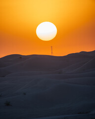 Fototapeta premium A view of desert dunes at sunset