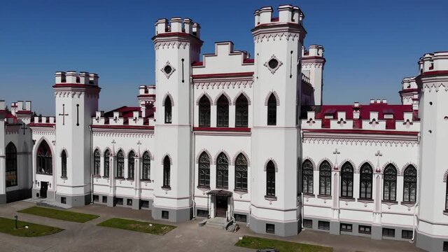 View on the old castle-palace Puslovsky, national landmark. Kossovo, Belarus. Aerial video 4K