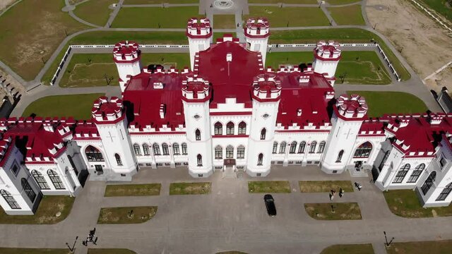 View on the old castle-palace Puslovsky, national landmark. Kossovo, Belarus. Aerial video 4K