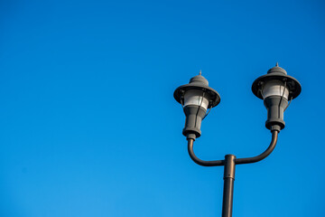 Street lamp on blue sky background with room for copy