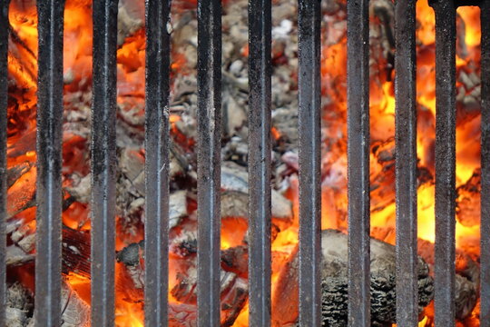 Barrel Or Brazier Grill Pit With Flaming Charcoal. Top View Of BBQ Hot Grill With Cast Iron Grid, Isolated Background, Overhead View. Barbecue Grill Background Texture